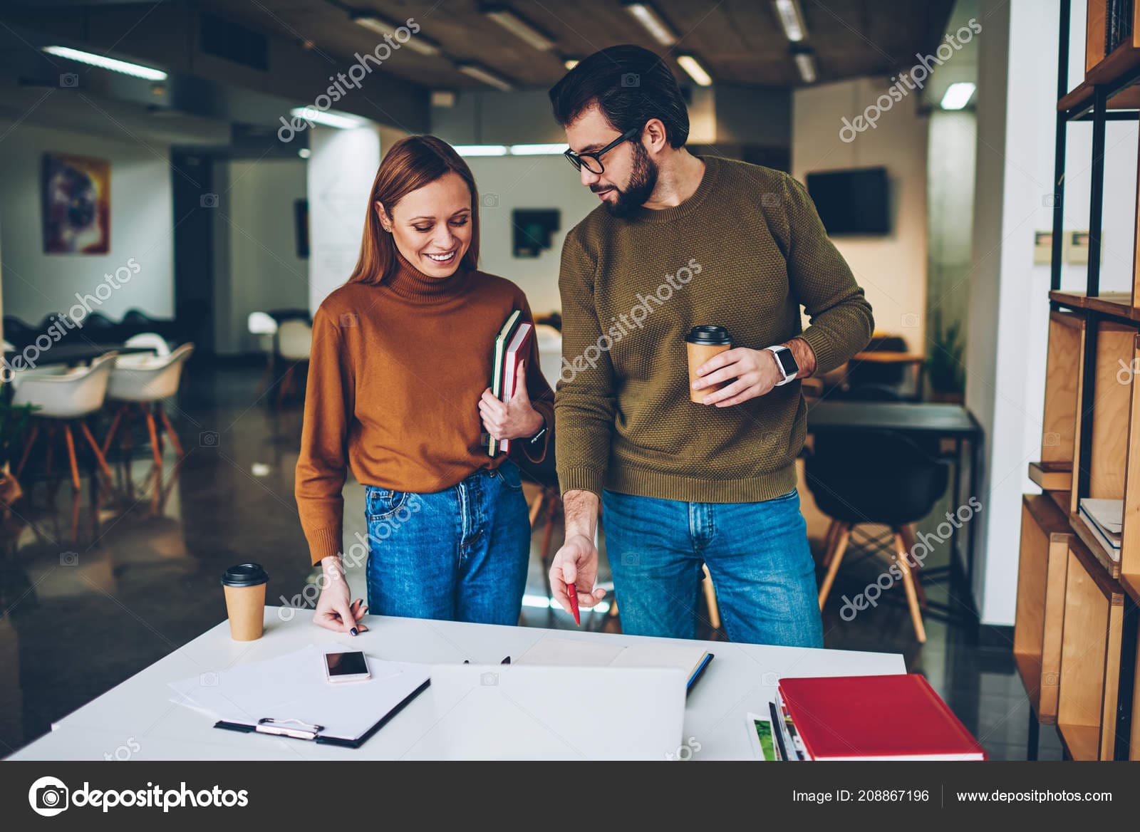 Stock photo two young casually dressed colleagues.