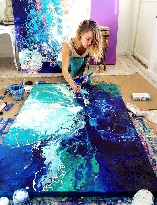 Female Artist Pouring Acrylic Medium For Painting Picture In Fluid Pouring  Technique Stock Photo - Download Image Now - iStock