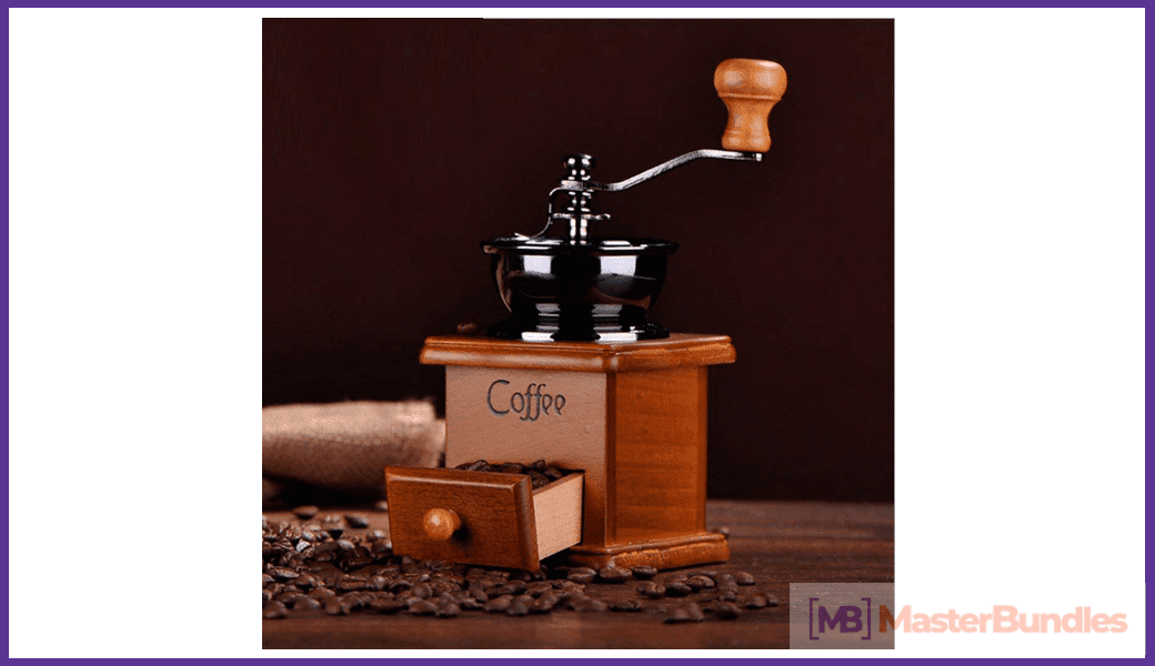 Coffee grinder machine in vintage style and manually operated.