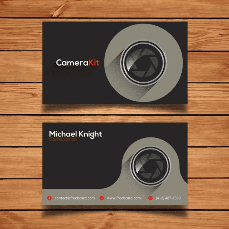 Black-gray card with a lens. Two colors are used for the font - white and red.