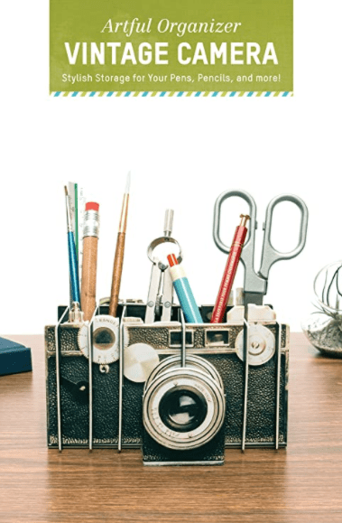 Stylish pen holder in the shape of a vintage camera.