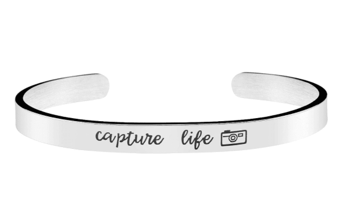 A laconic silver bracelet with a motivational phrase would be a suitable gift.