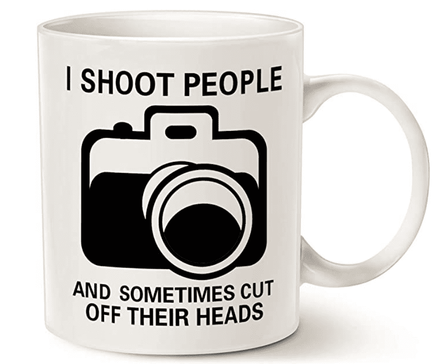 A cup is always an appropriate gift. This cup with a white background and a black camera and an inscription will become a photographer's assistant on the set.