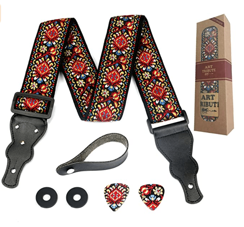 Stylish guitar strap with red ornaments.