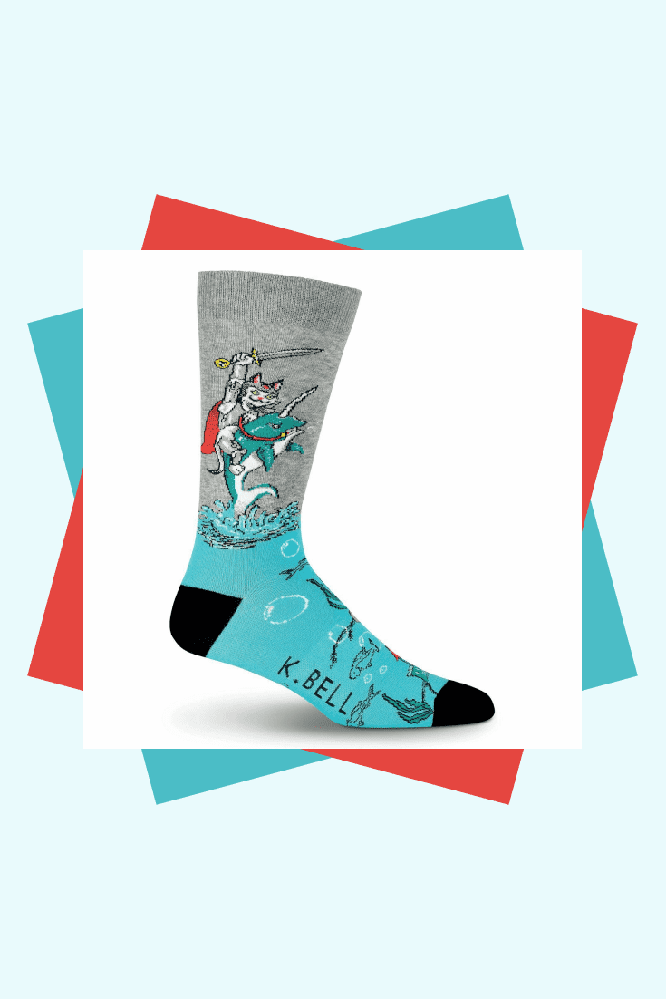 Bright gray-turquoise socks with a picture of a warrior cat will be a good addition to your collection.
