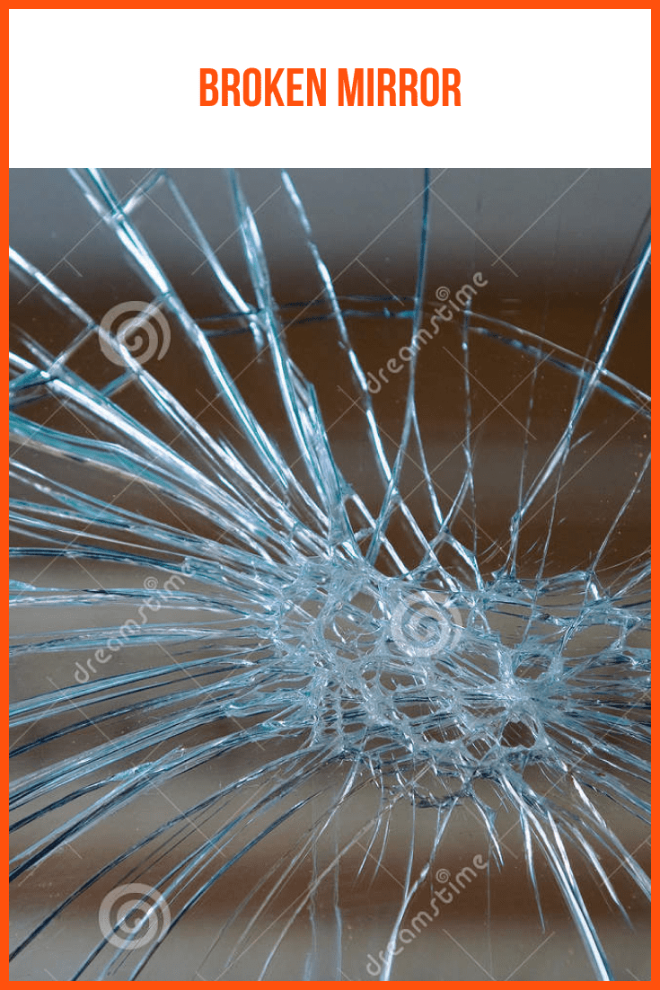 Broken glass with the effect of a bullet shot.