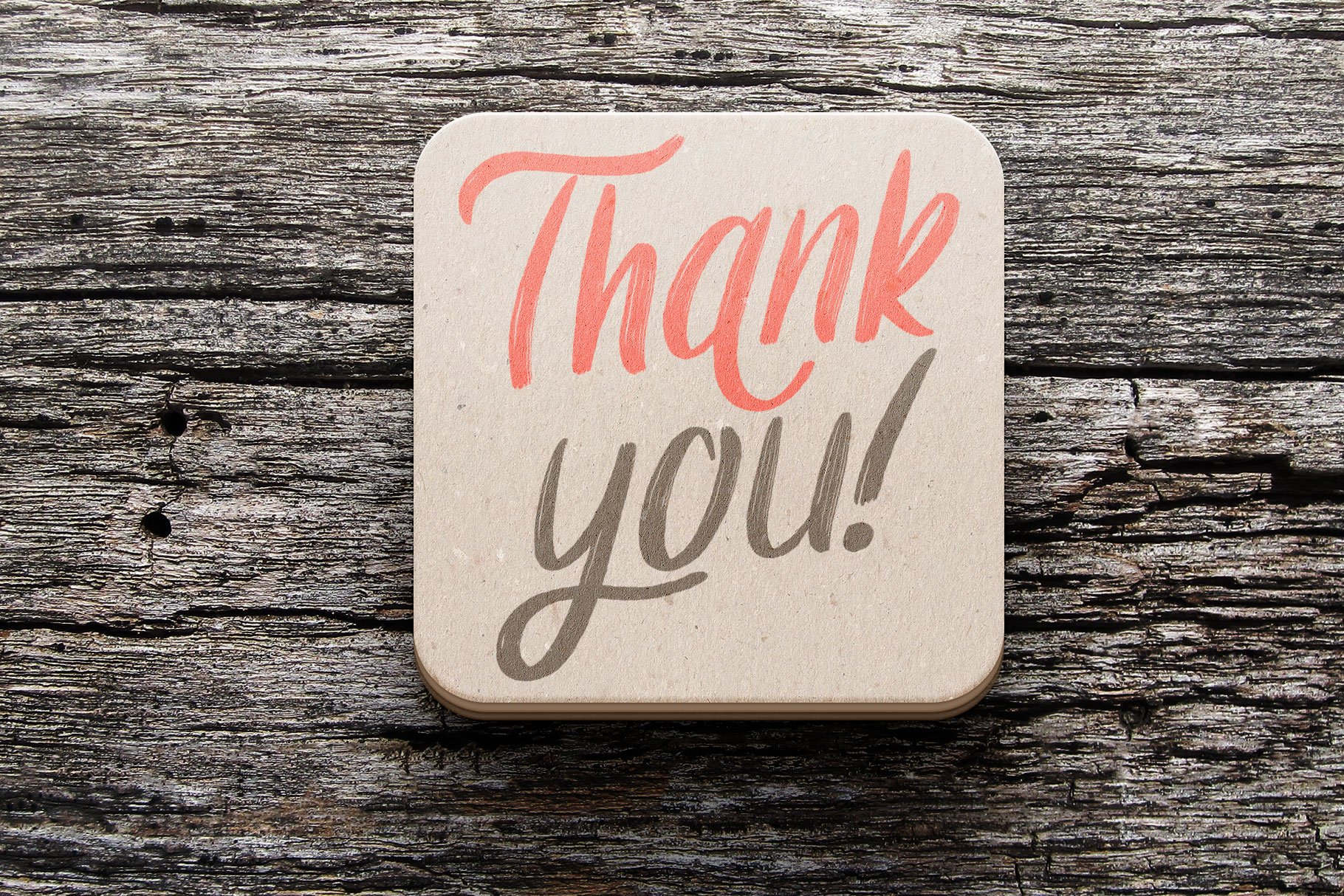 Rustic thank you on a wooden background.