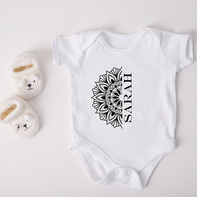Mandala Monogram Design Bundle on baby clothing.