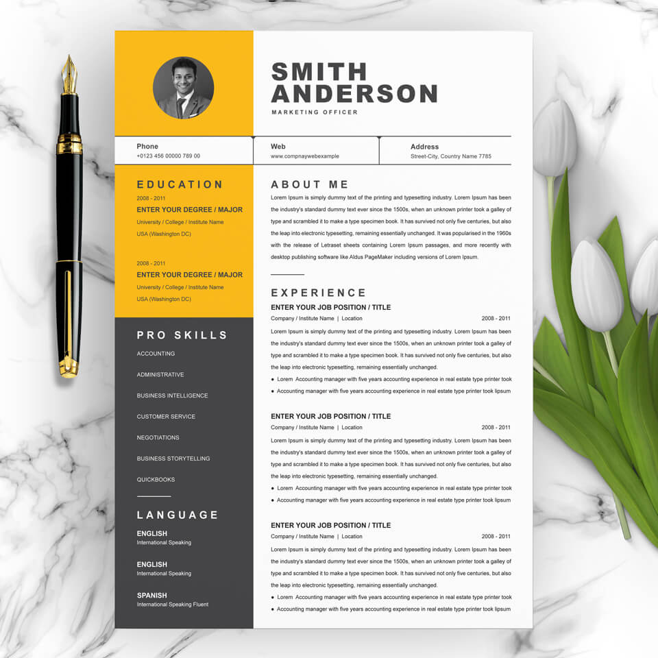 Yellow and black resume on a marble table.