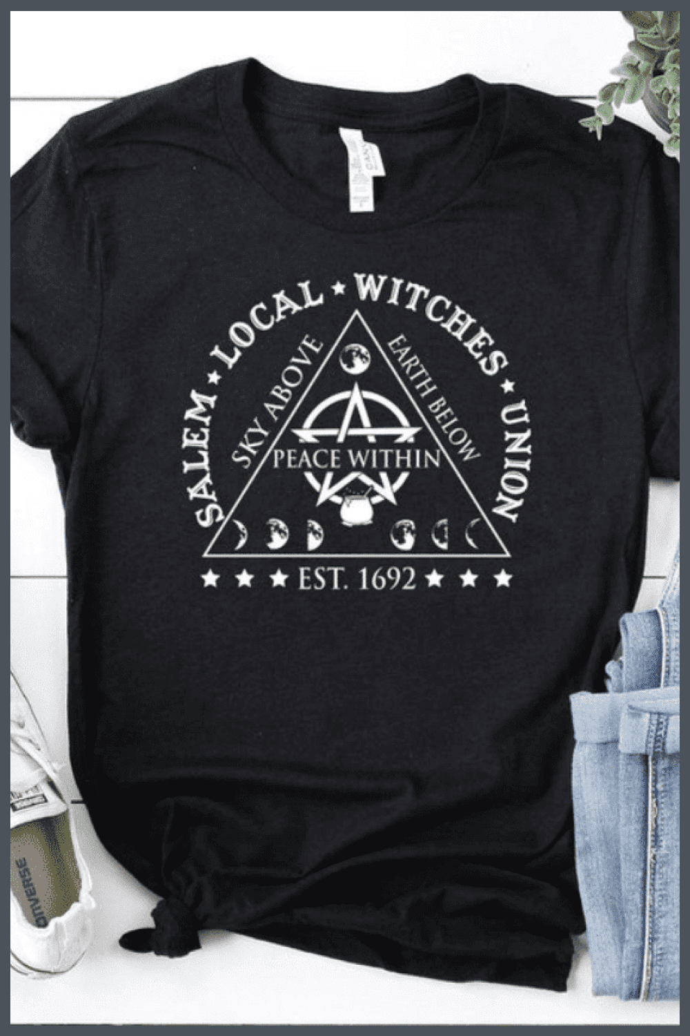 Black T-shirt with a triangle and spells.
