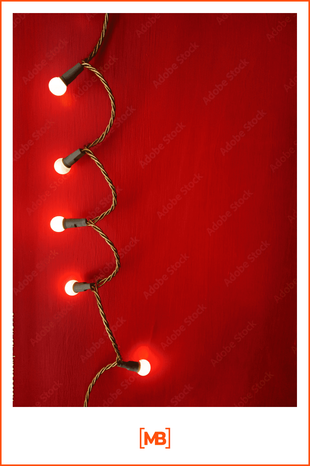 lighted garland for the Christmas tree on a red background.