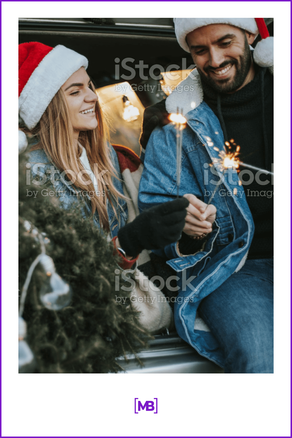 a couple in santa claus hats and sparklers rejoice Christmas.