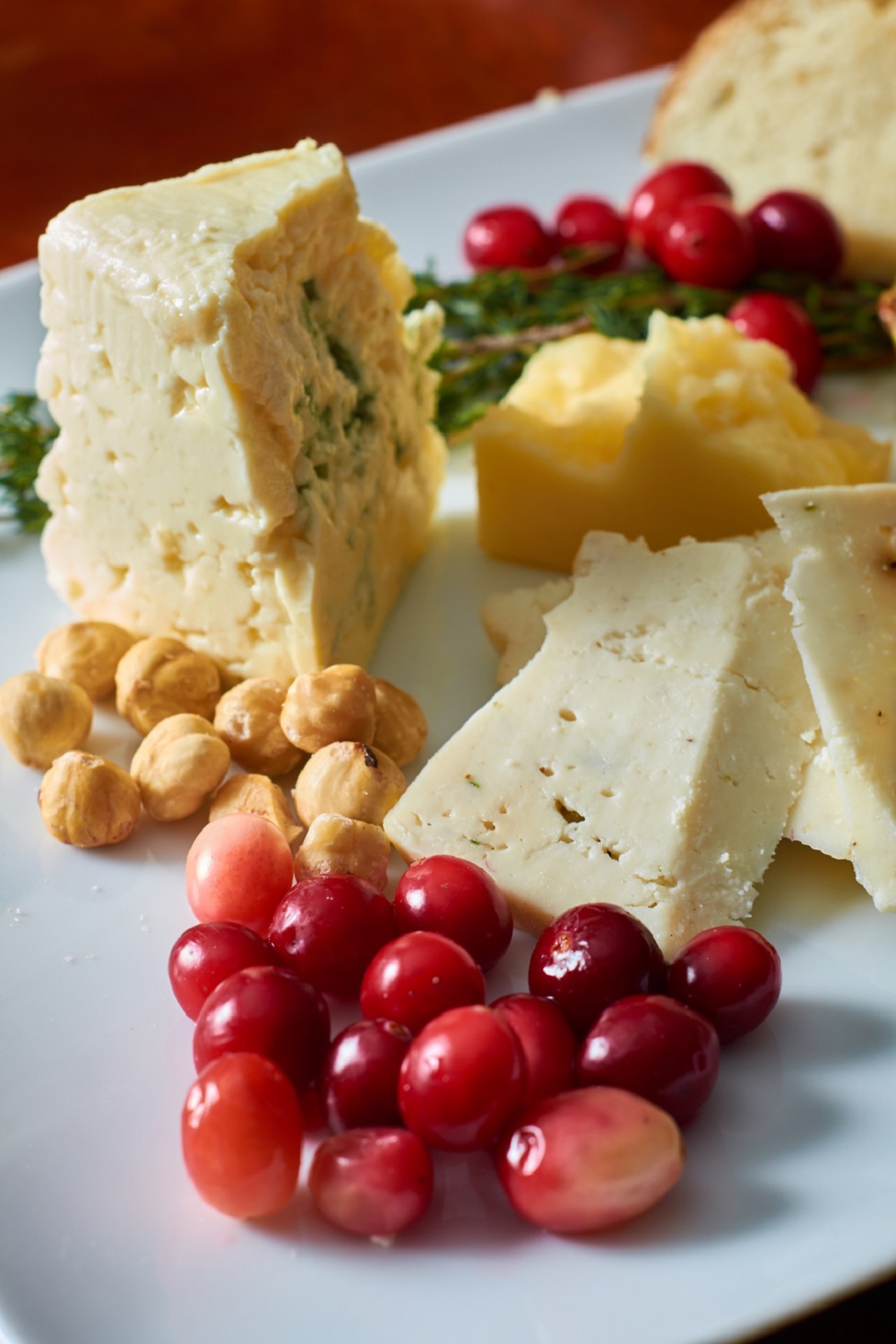 Cheese plate with berries and nuts - pinterest image.