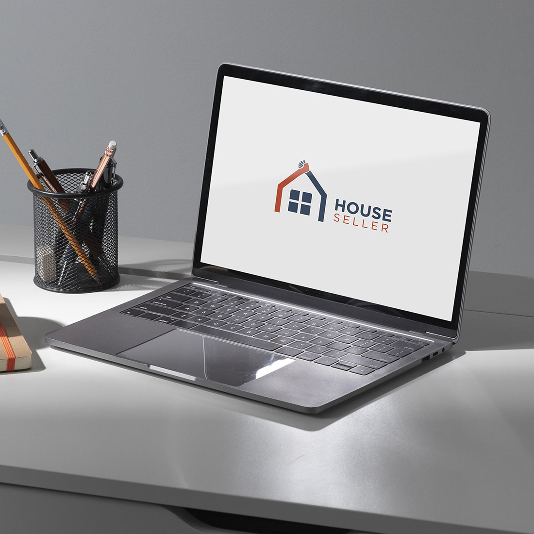 laptop mockup House Seller Logo Design