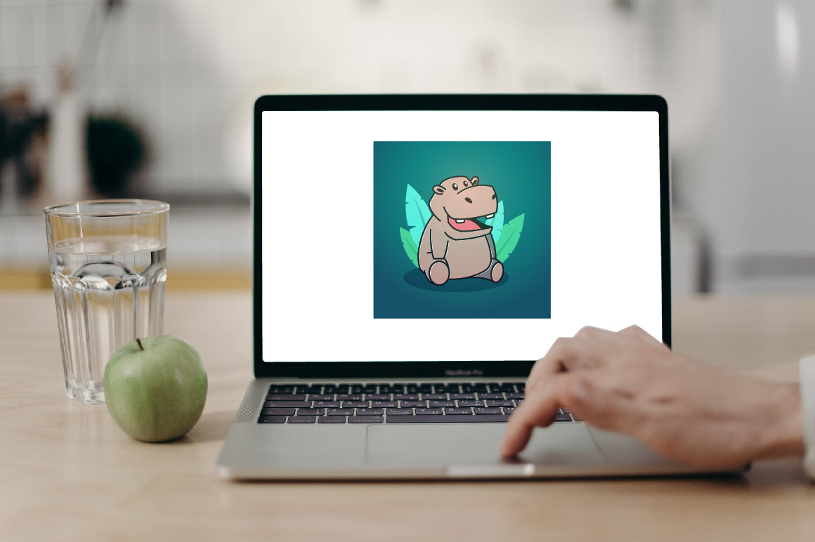 Funny Hippopotamus Cartoon Character - Mockup on Notebook.