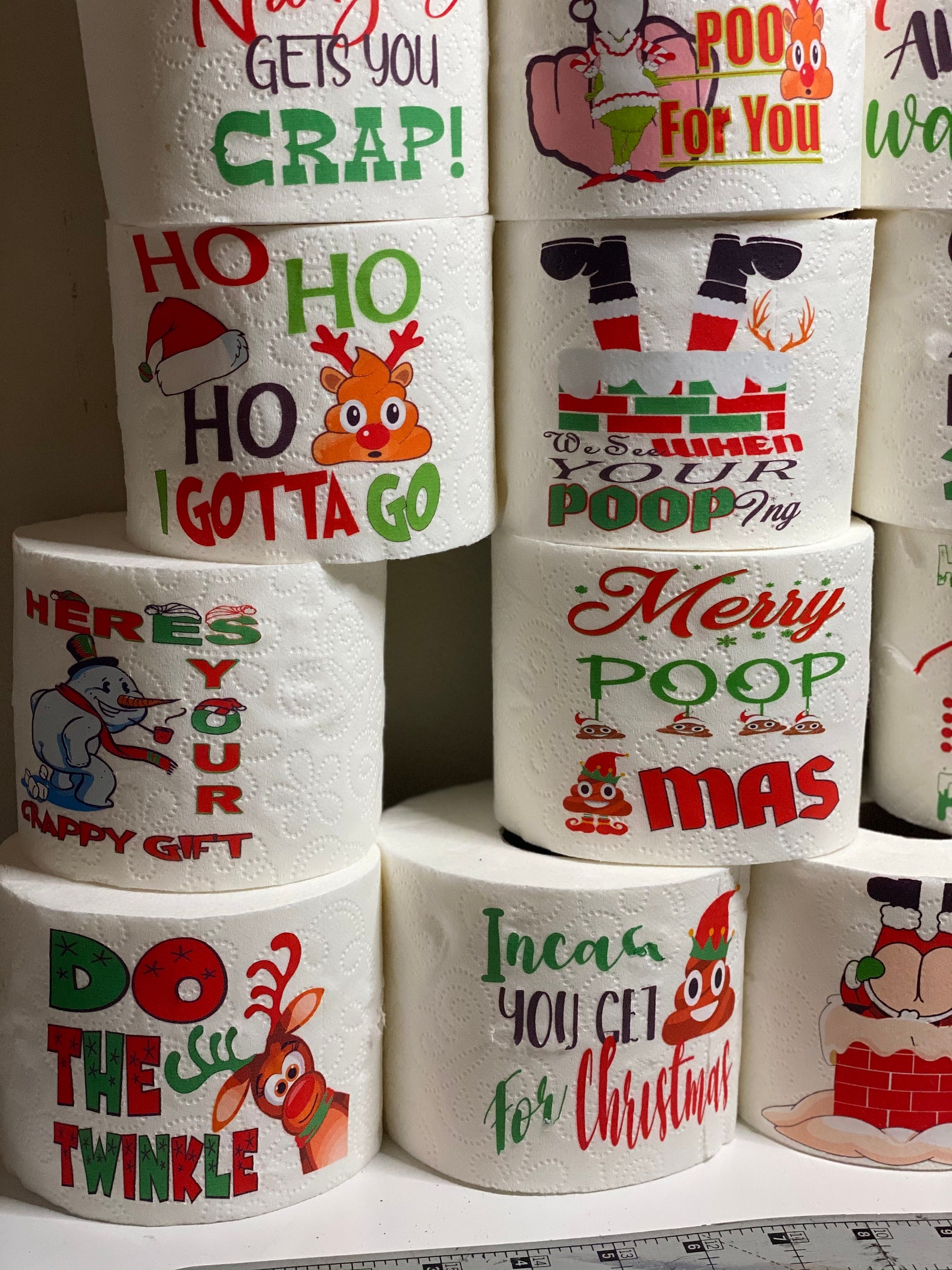 Big collection of toilet paper with Christmas illustrations.