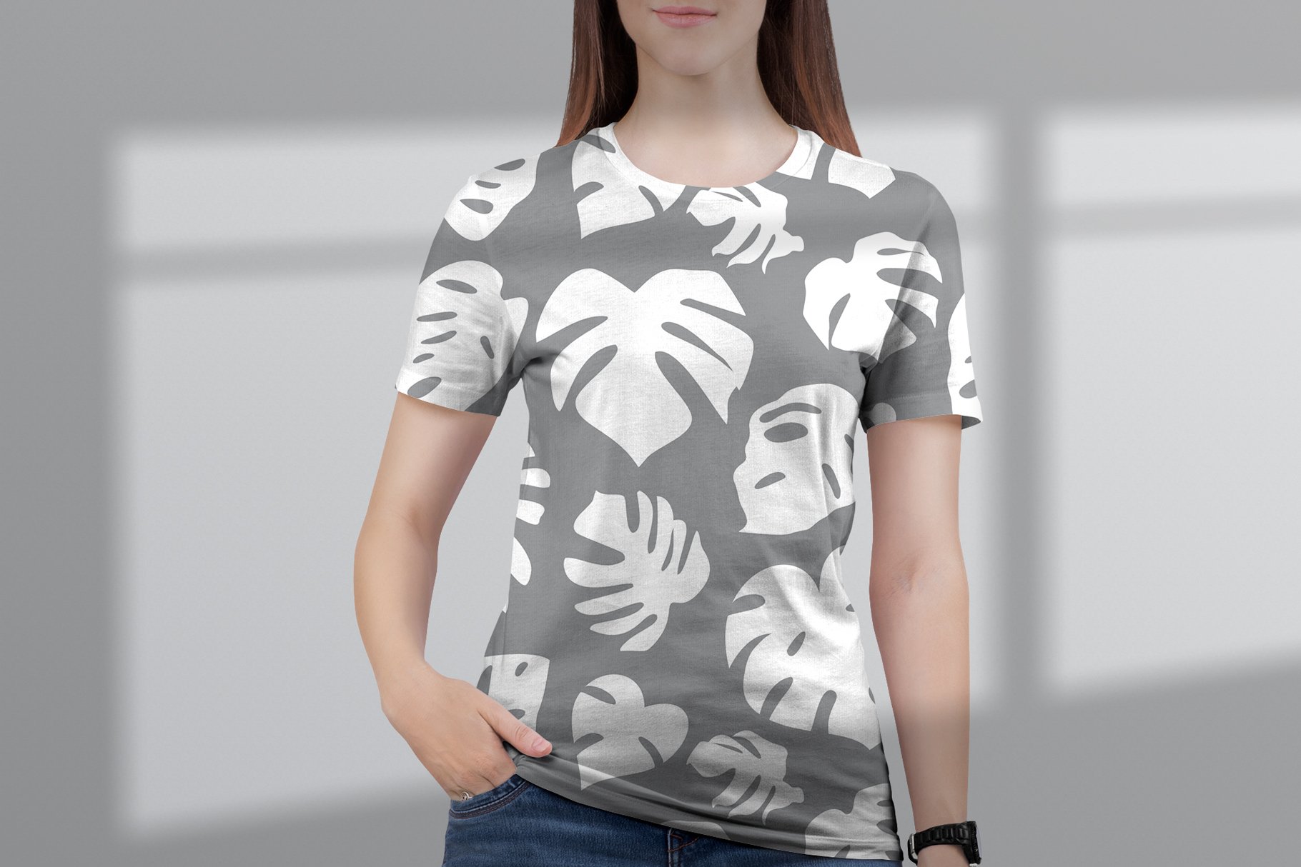 Grey t-shirt with white leaves.
