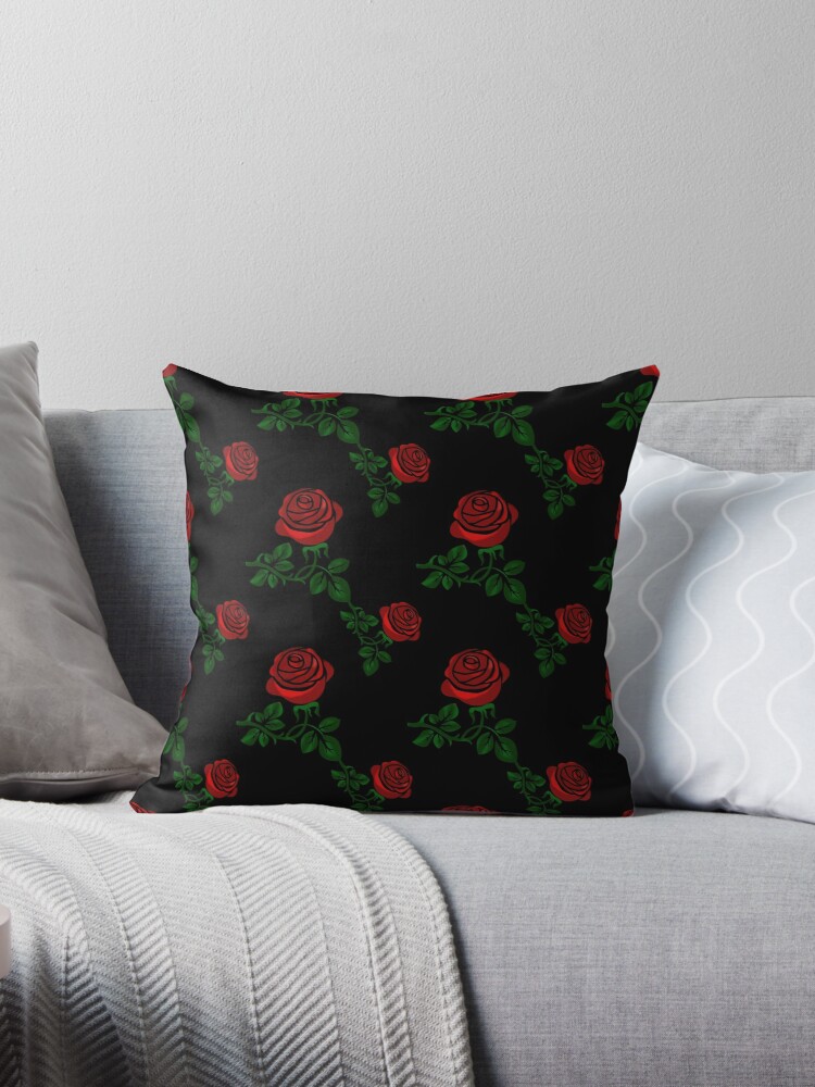 Dark pillow with roses.