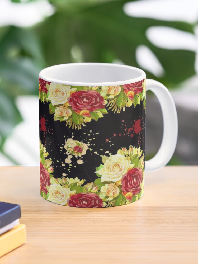 White cup with flowers.