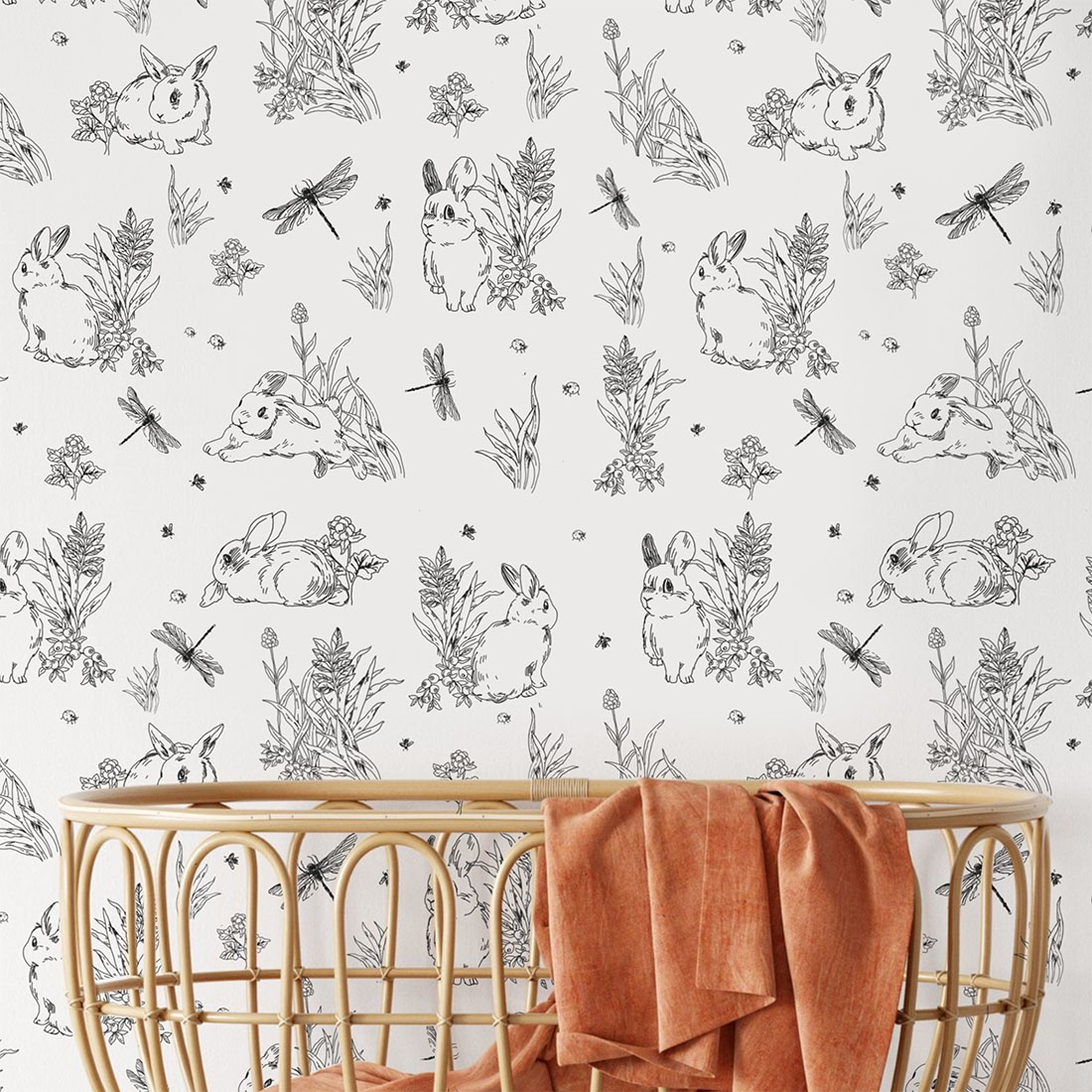 Black and white pattern with rabbits and plants.