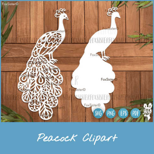 Paper cutout of two peacocks on a wooden background.