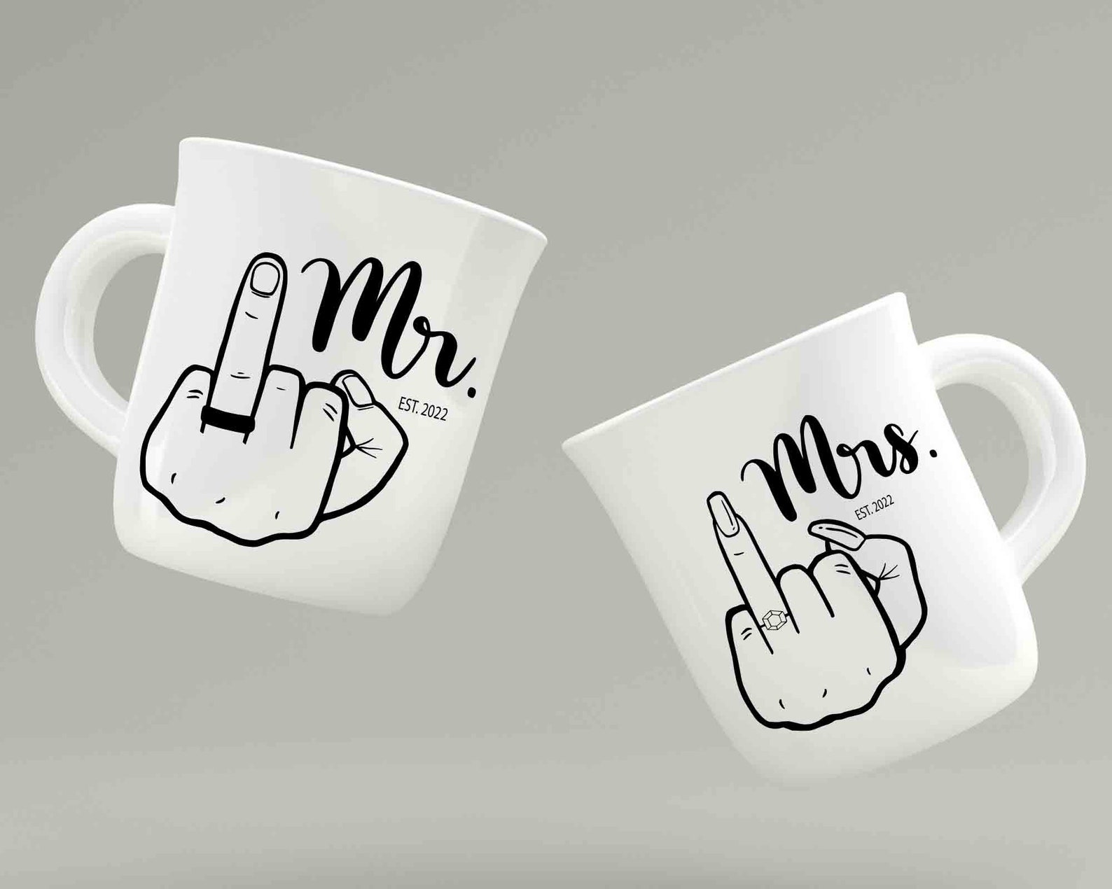 Two white cups with wedding finger.