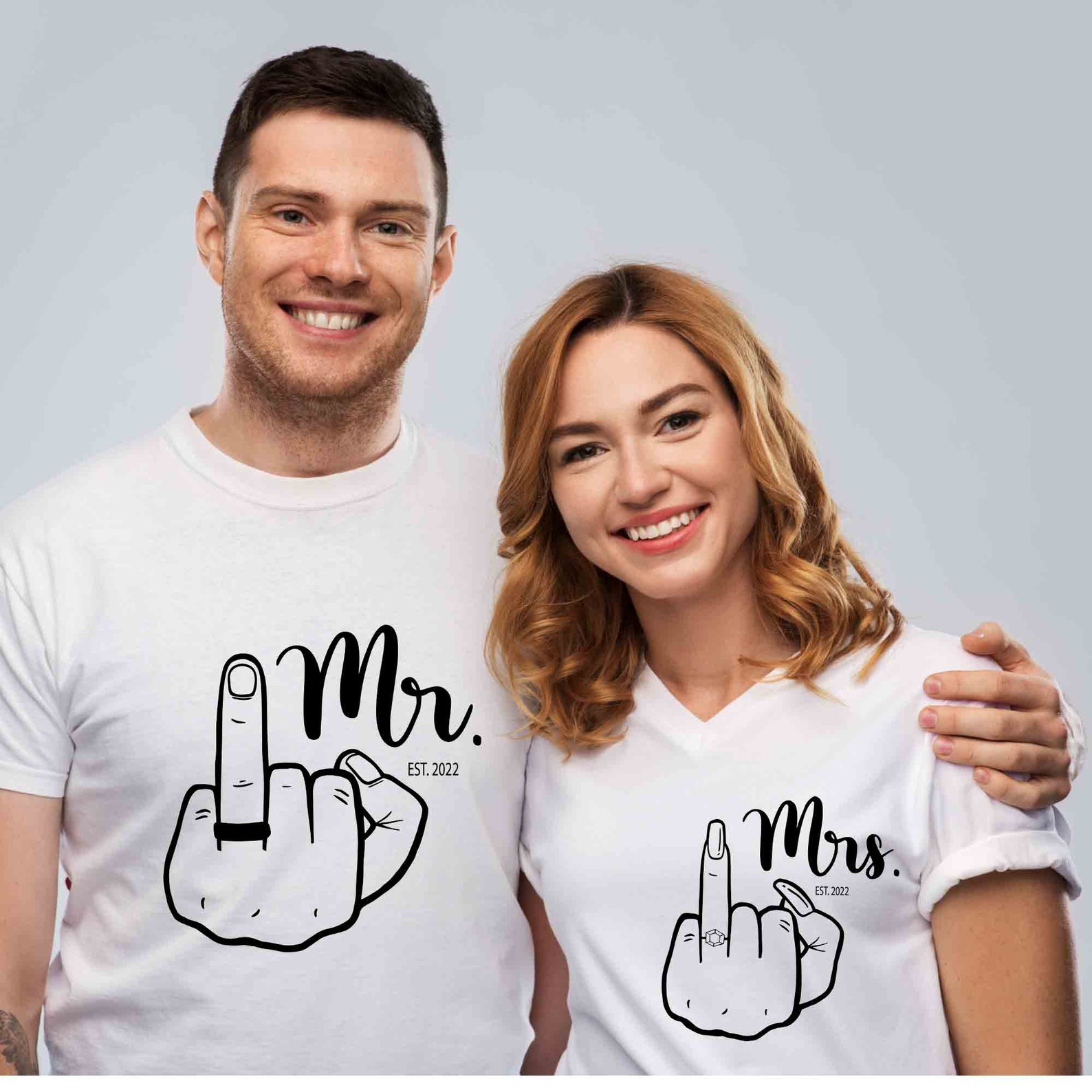 White t-shirt with wedding finger.