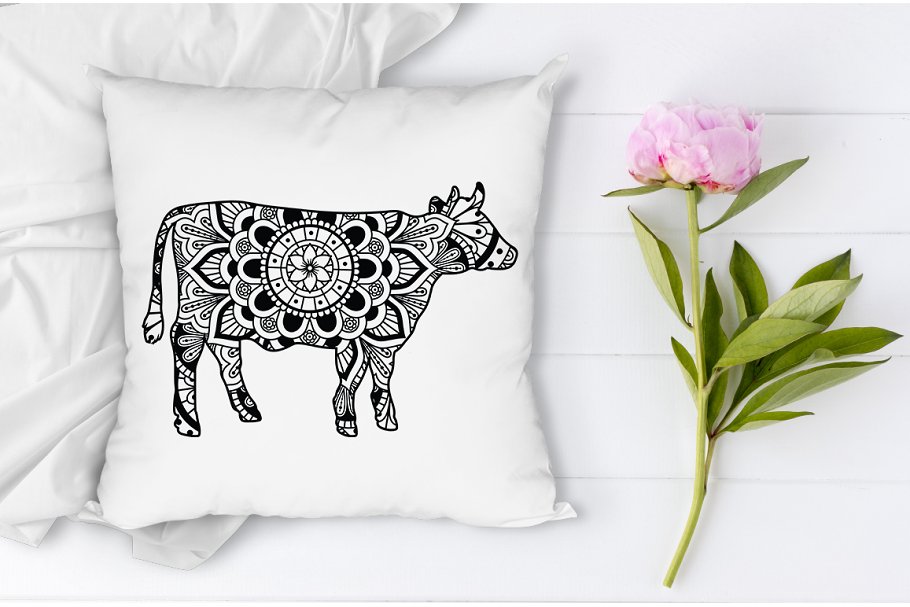 Pillow with a picture of a floral cow.