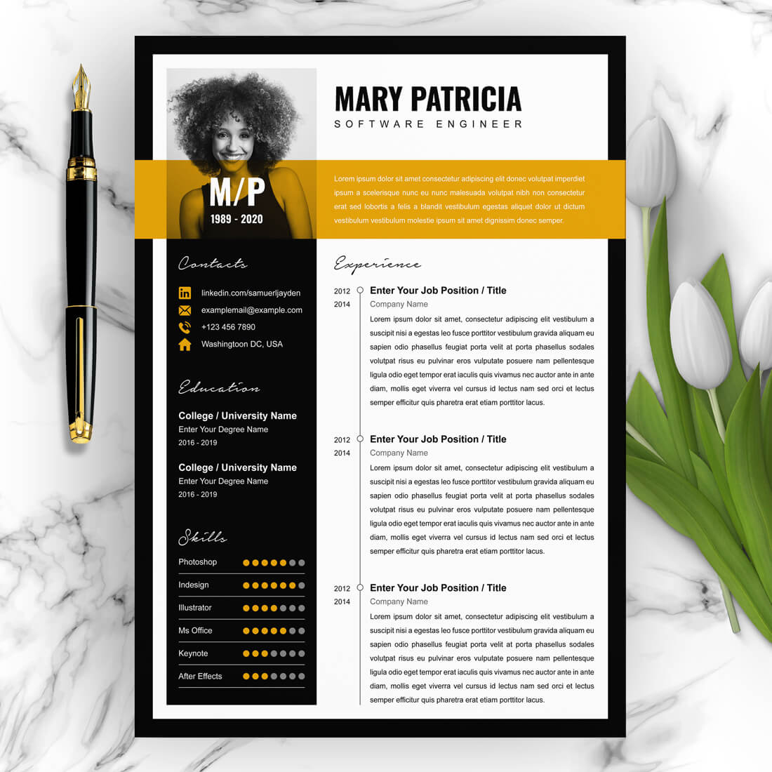 Black and yellow resume on a marble table.