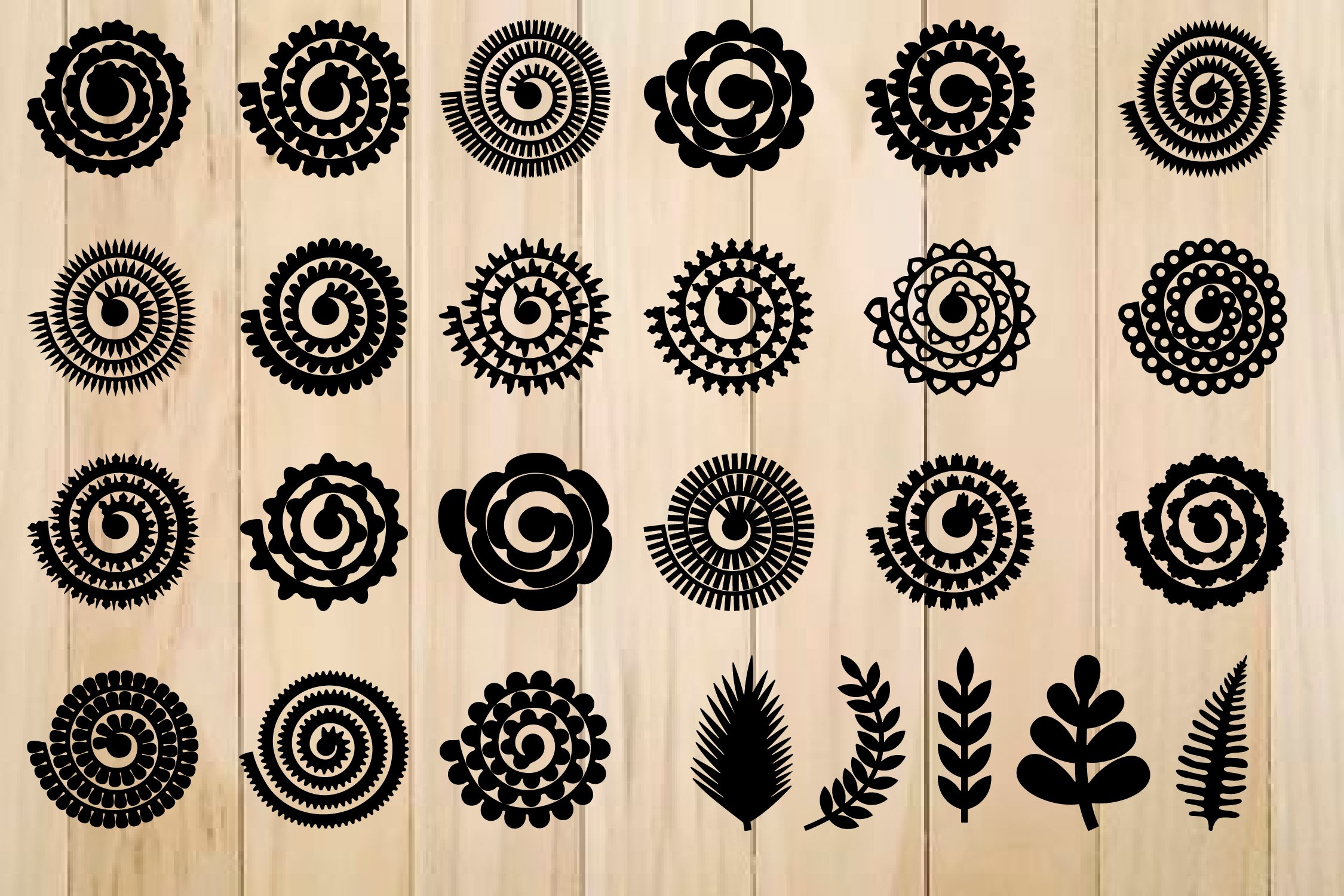 Black rolled flowers for different brands and projects on a beige wooden background.