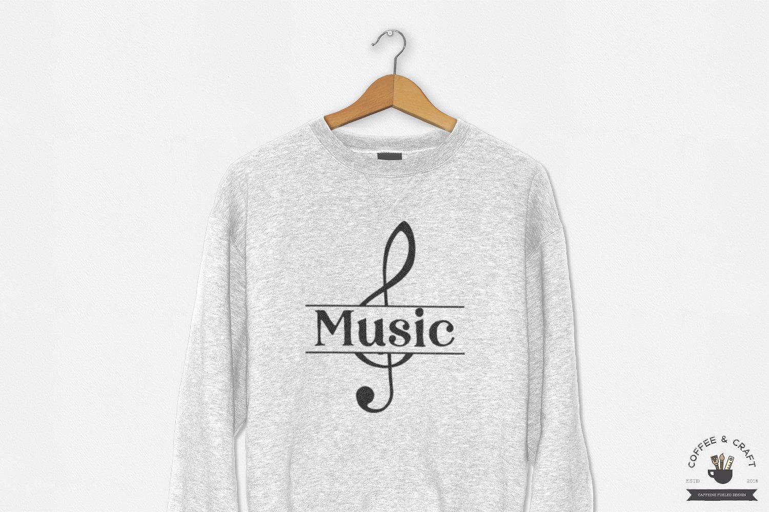 Grey t-shirt with music note illustration.
