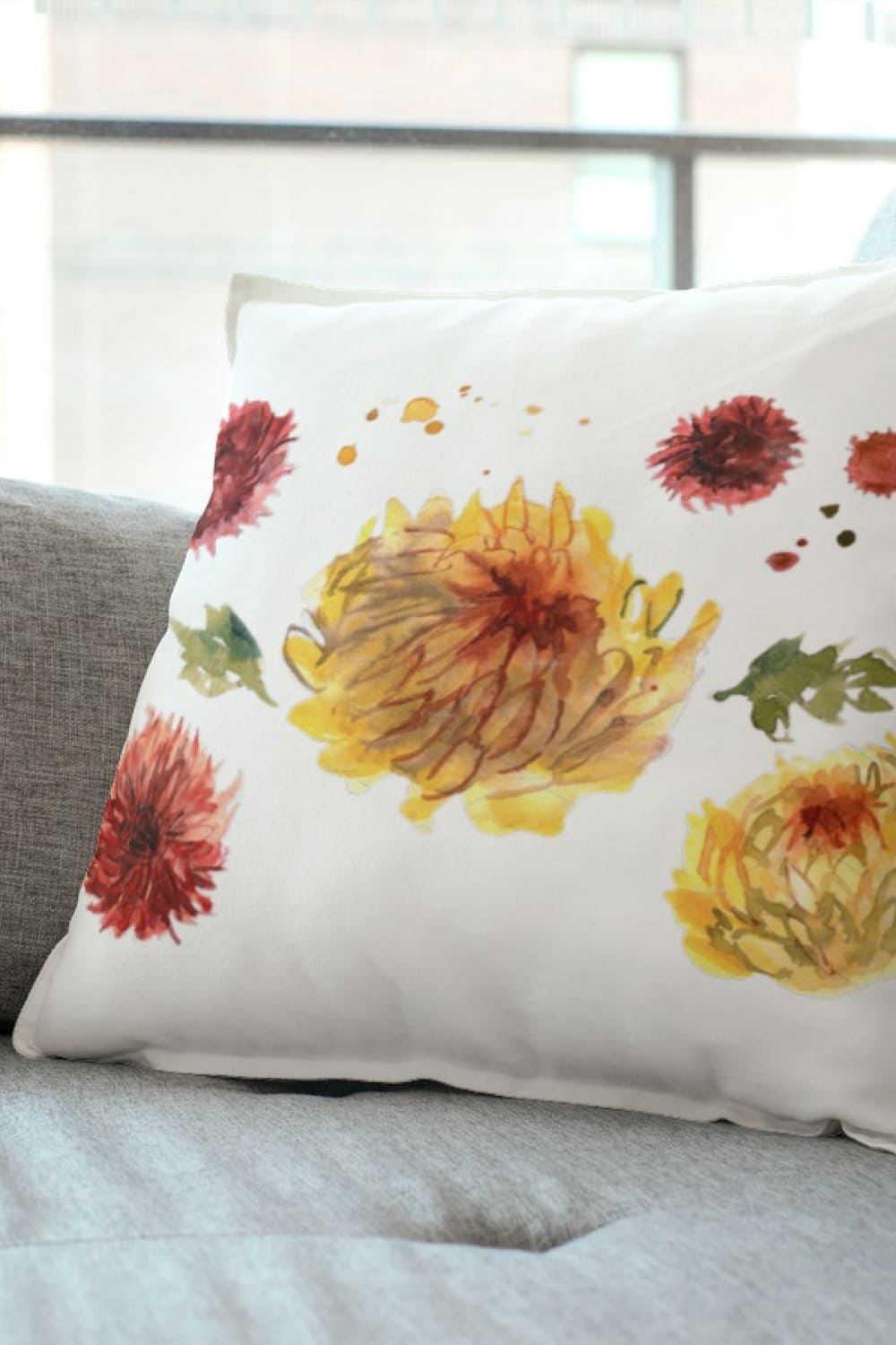 Pillow with watercolor gerberas and chrysanthemums flowers.