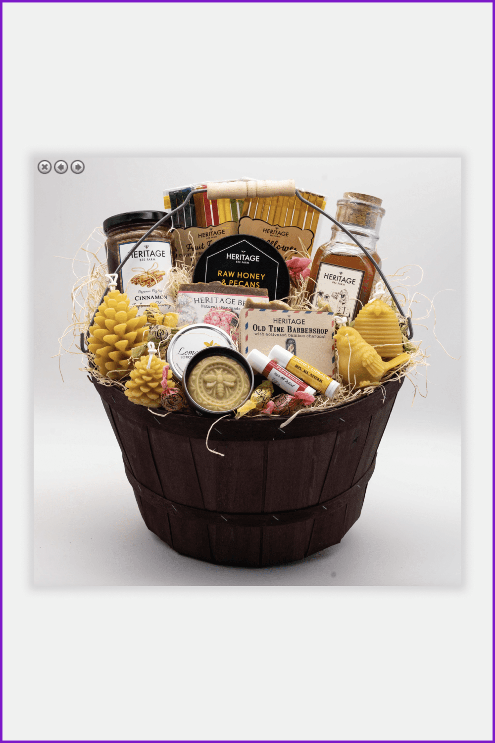 Basket with honey jars, homemade soap, beeswax lip balms, and candles.