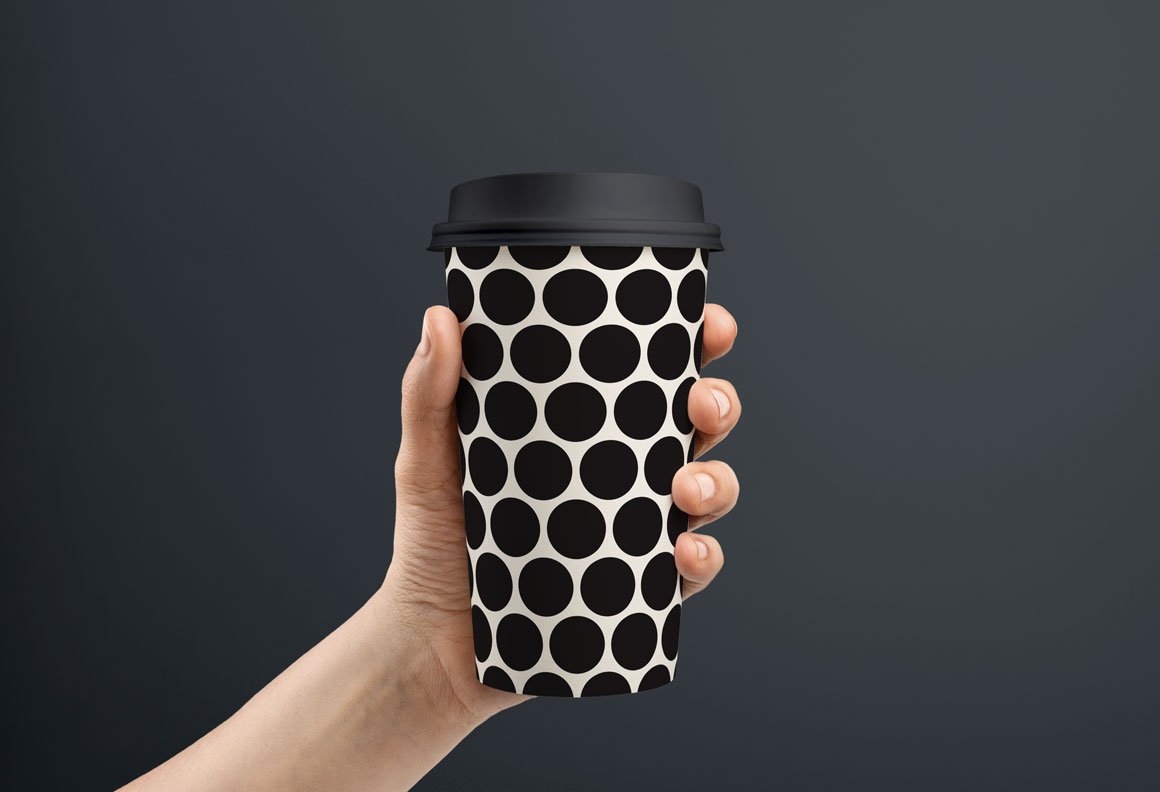 White cup with the black dotted.