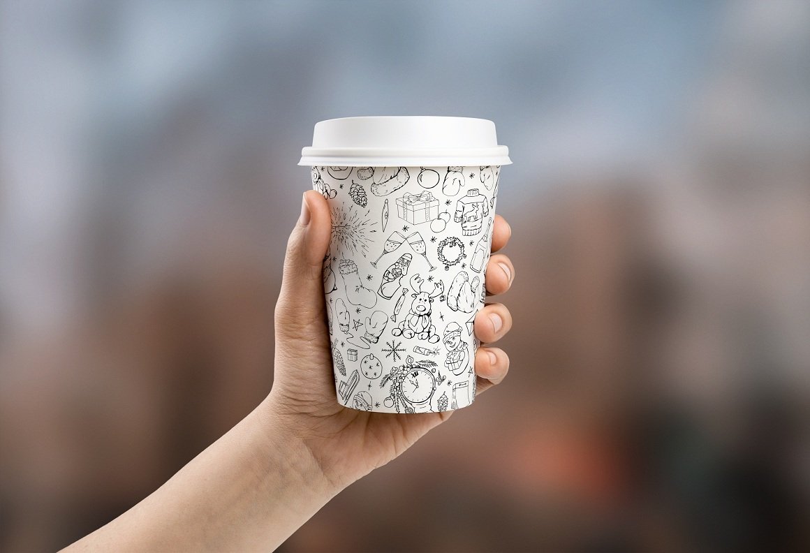 White cup with the Christmas illustrations.