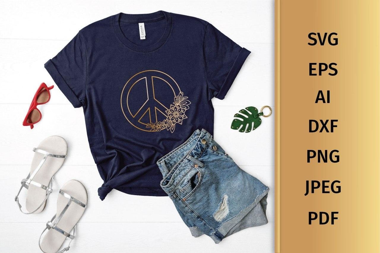 Dark blue t-shirt with a gold floral peace sign.