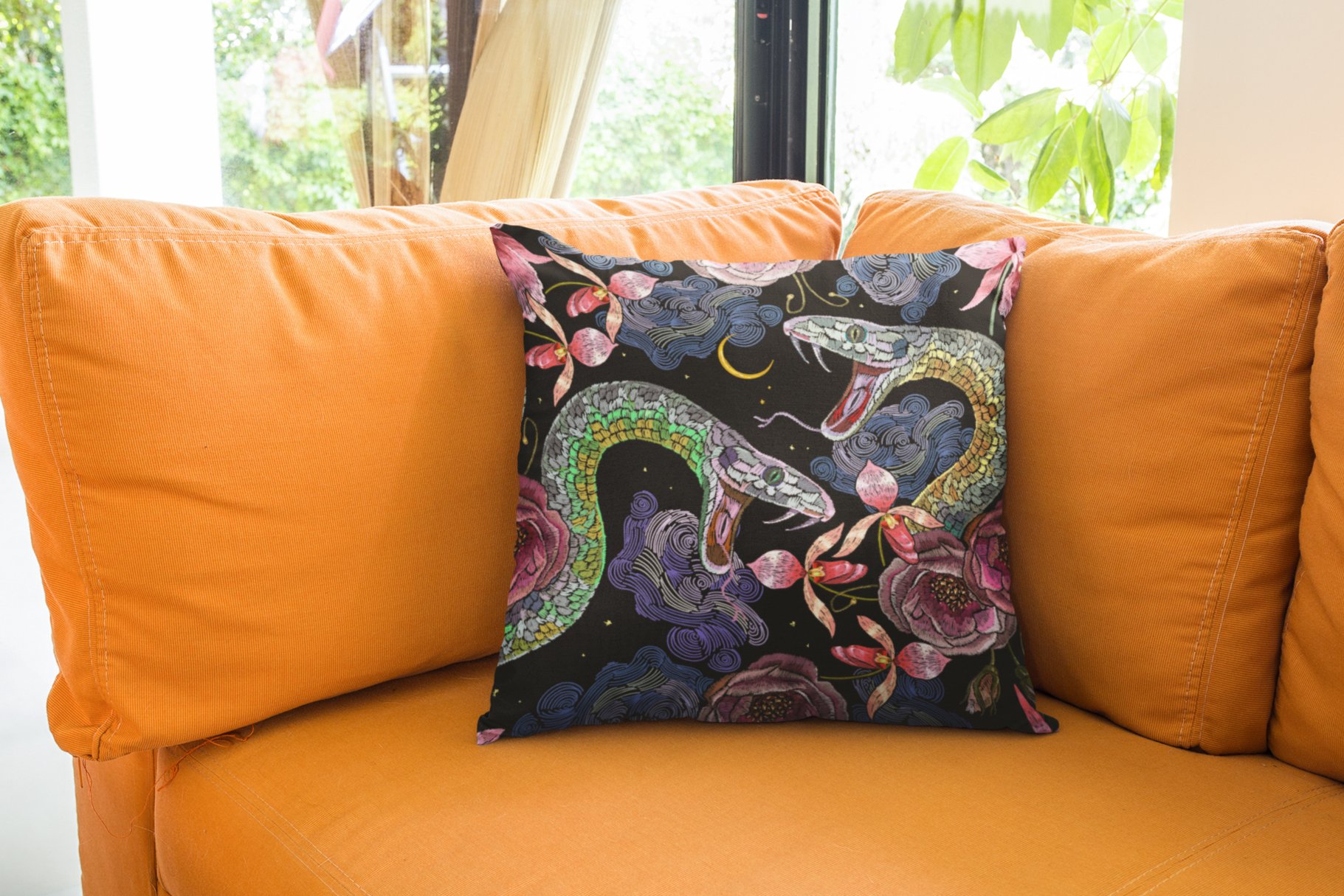 Vivid decorative pillow with a snake print.