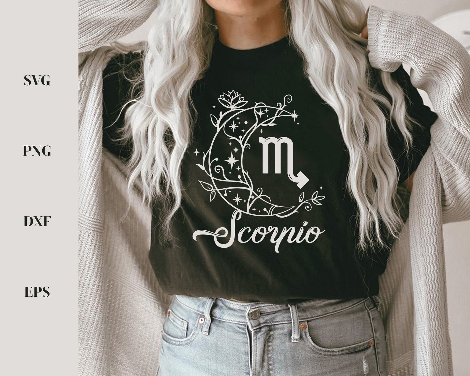 Woman wearing a black shirt with a zodiac sign on it.