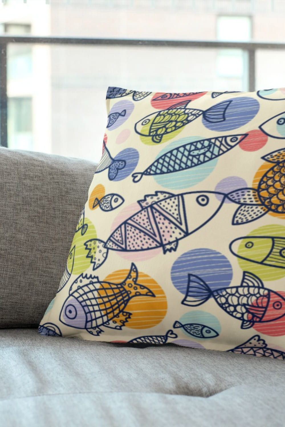 Pillow with graphics fishes.