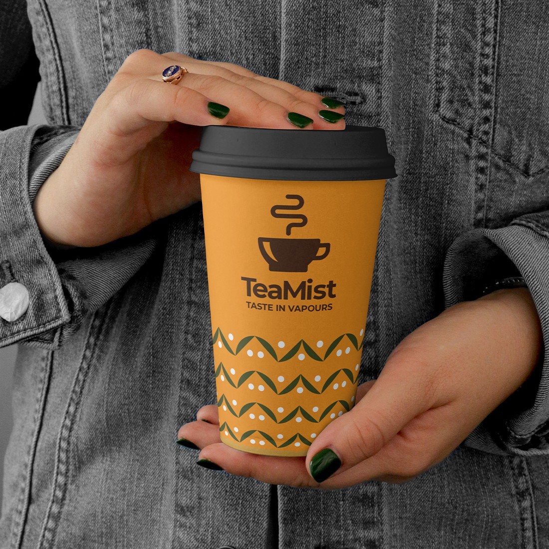 Orange paper cup with the black logo.