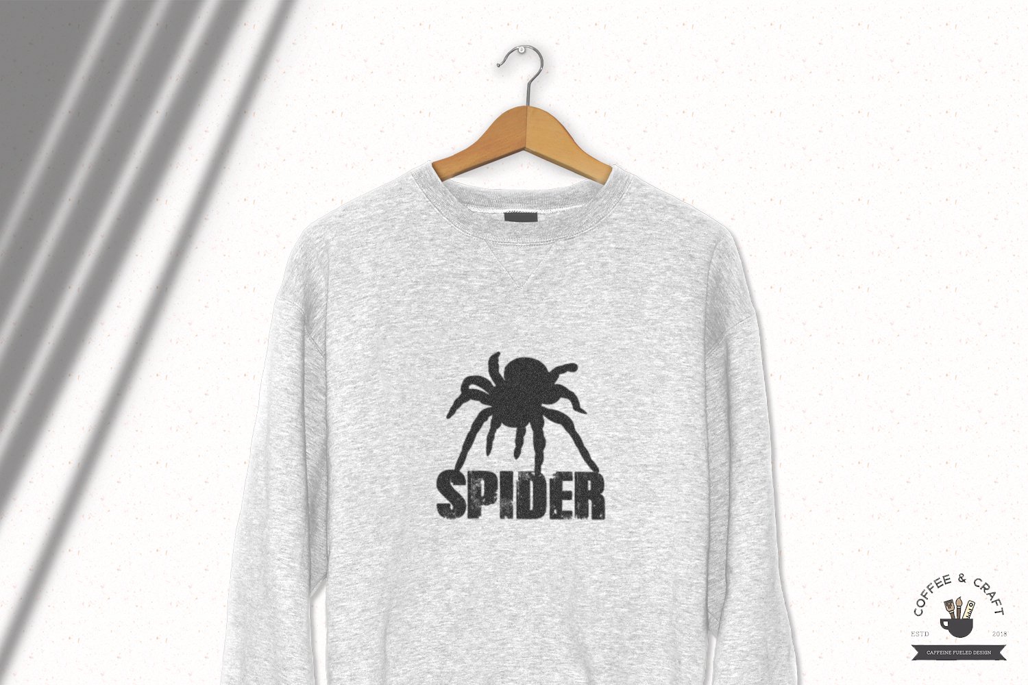 grey sweatshirt with spider.