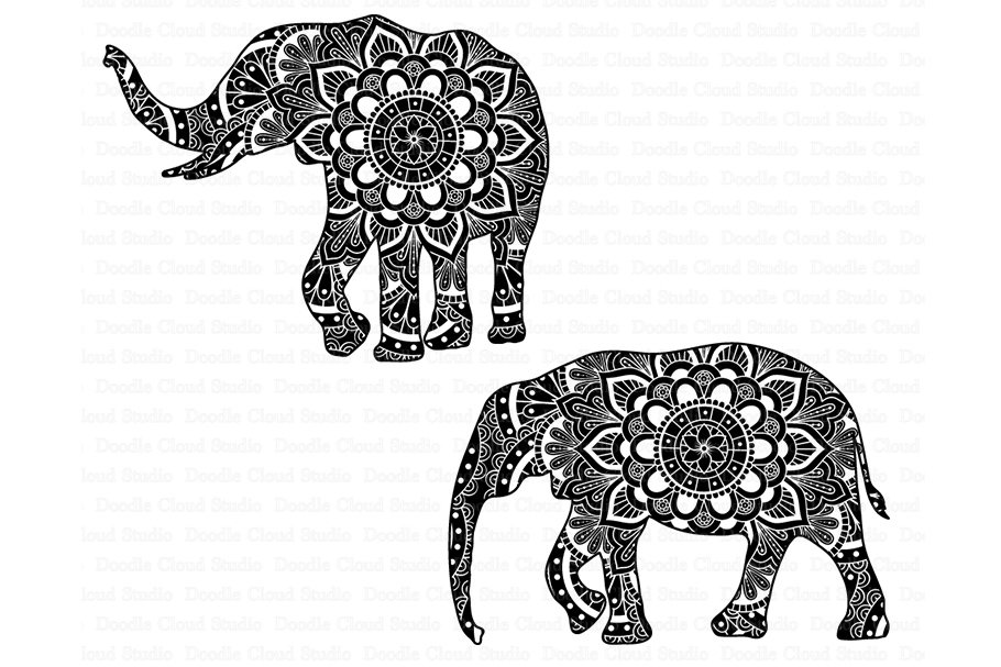 Two elephants with intricate designs on their backs.