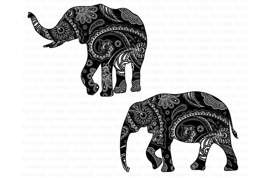 Two elephants with intricate designs on their backs.