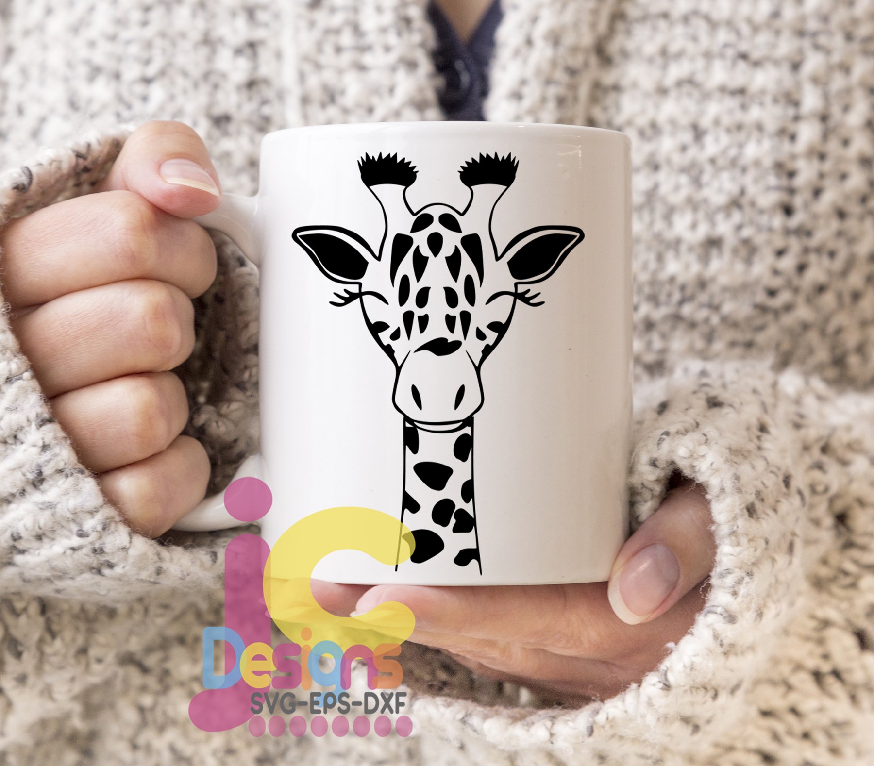 Person holding a coffee mug with a giraffe design on it.