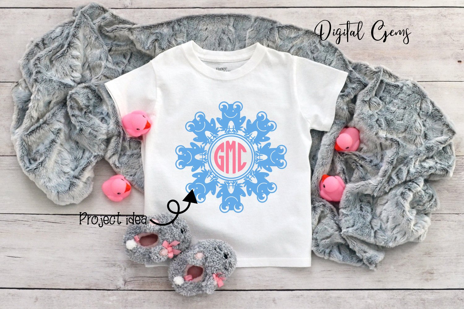 White shirt with a monogrammed snowflake on it.