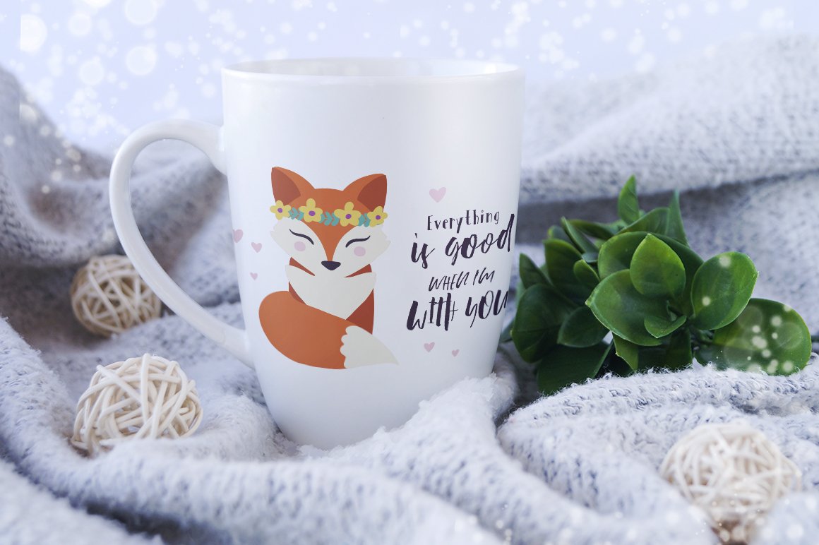 White coffee mug with a fox design on it.