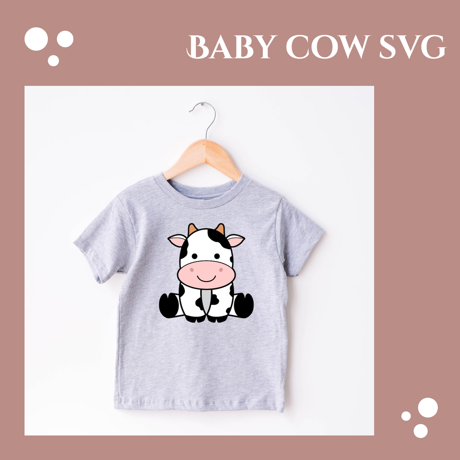 Baby cow t - shirt hanging on a hanger.