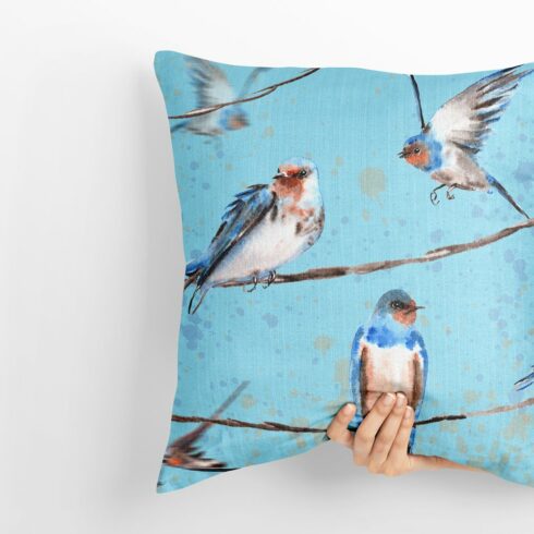 Blue pillow with swallow birds.