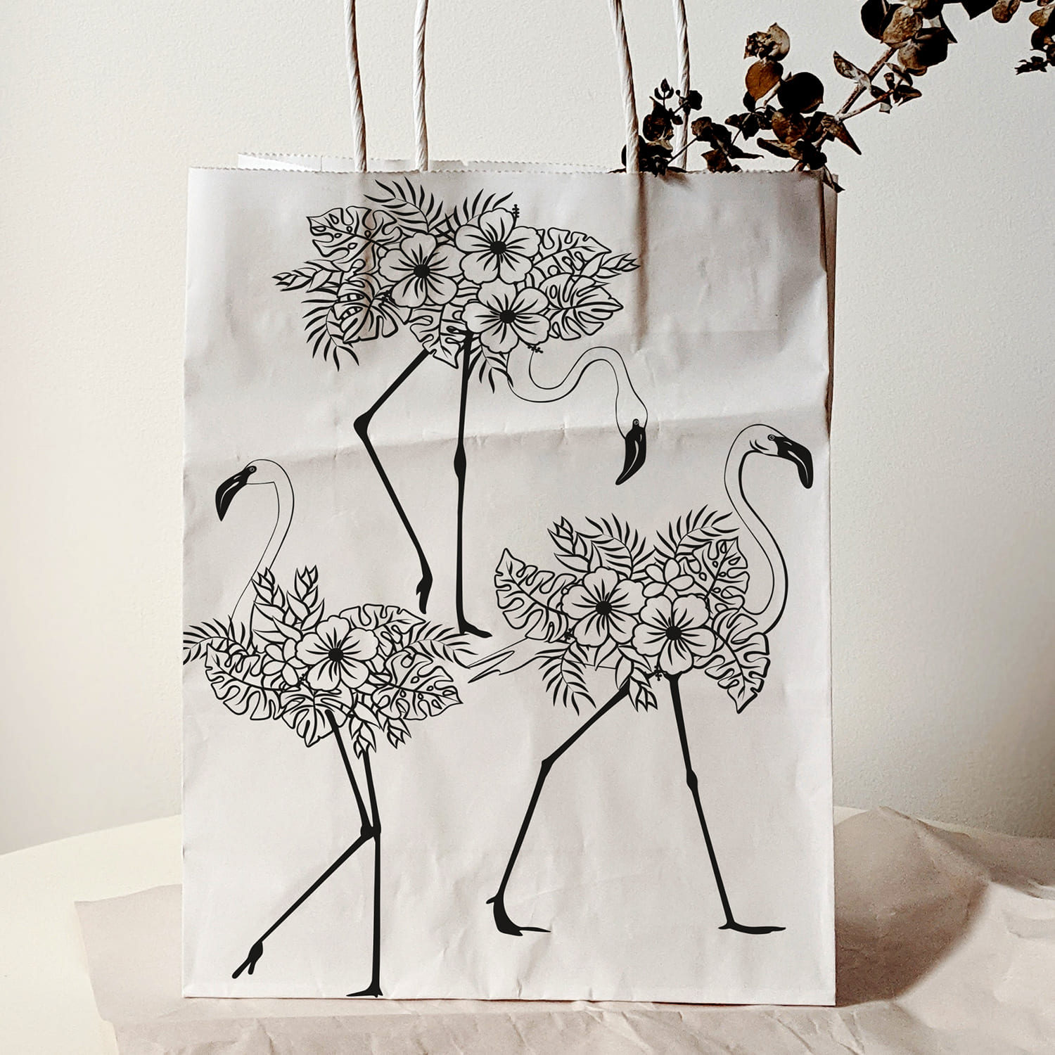 Two shopping bags decorated with flowers and flamingos.
