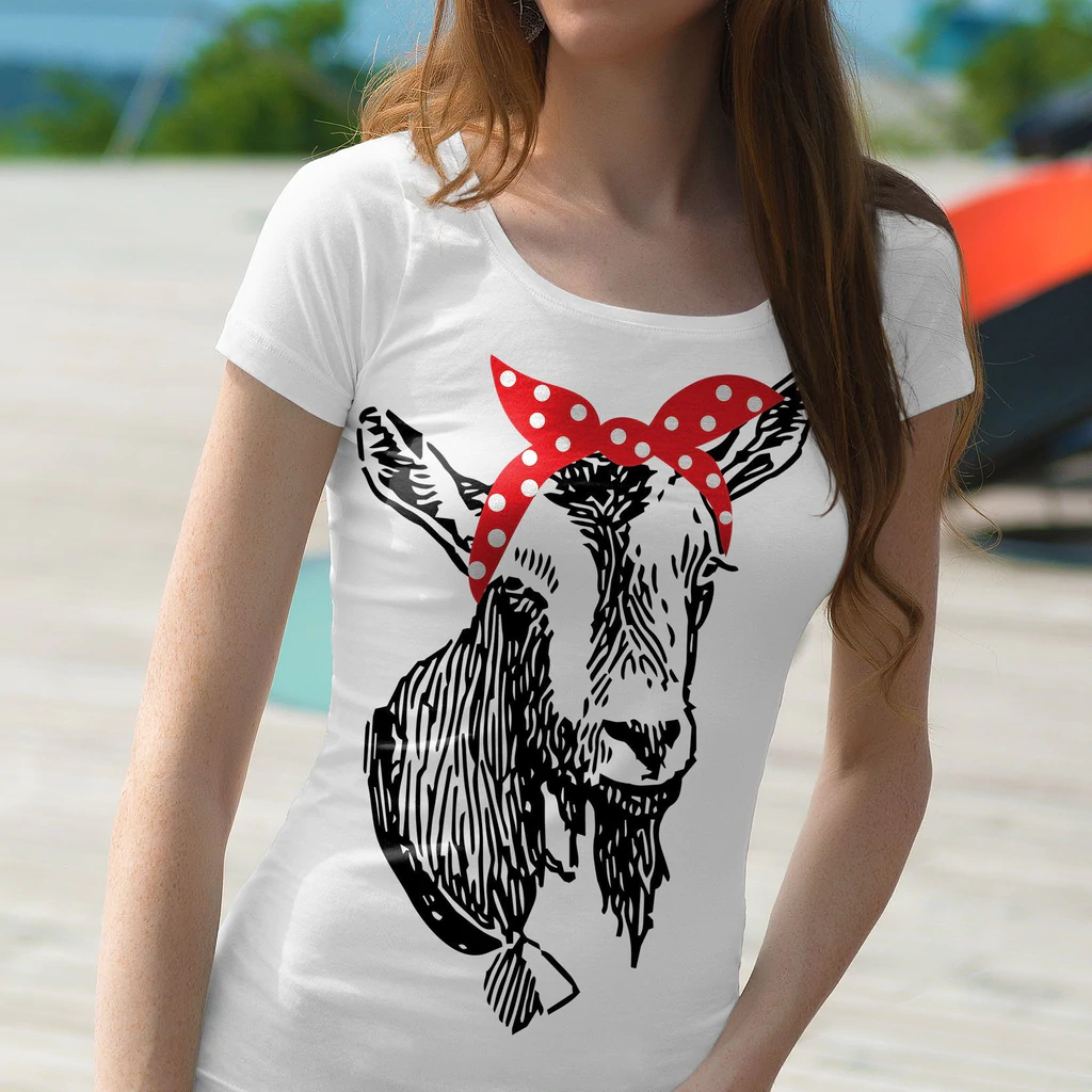 Woman wearing a white shirt with a cow on it.